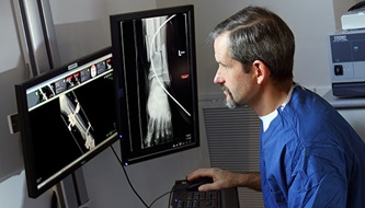 Dr. James Ficke looking at foot X-Rays before a surgery